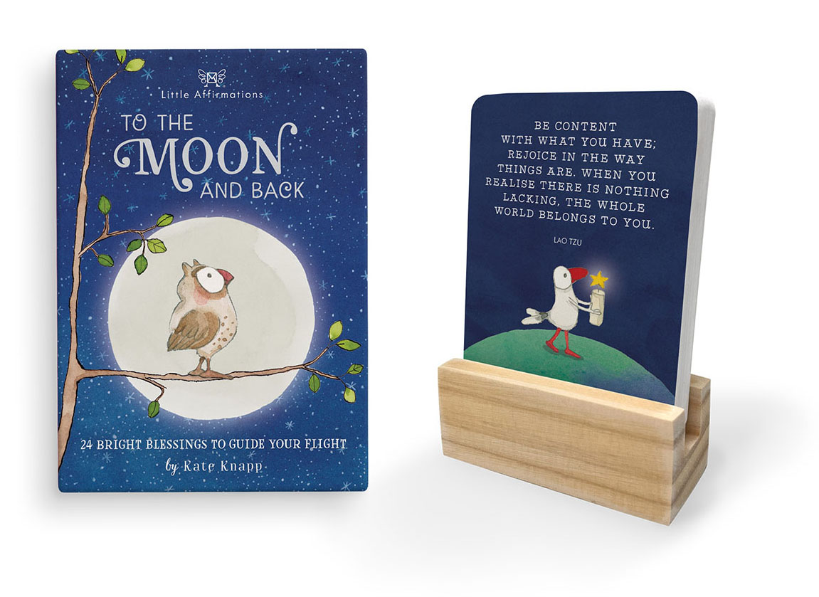 To the Moon and Back pack with owl artwork and a Twigseeds card in its wooden stand