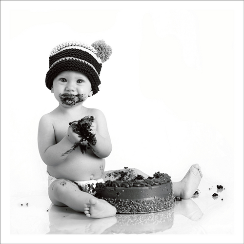 baby eating cake